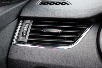 Interior of a modern car. Car conditioning. Car air vent grille. Vehicle vent interior for cold automobile cool. Auto climate condition. Hot air control panel. Car air conditioner.