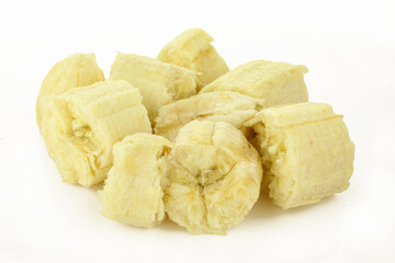 Group of chopped peeled banana pieces isolated on white background