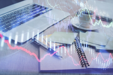 Multi exposure of forex graph drawing and desktop with coffee and items on table background....