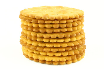 Stack of round salty crackers isolated on white background
