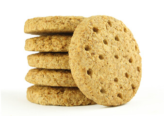 Stacked oat cereal cookies isolated on white background