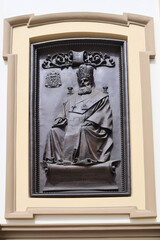 Fototapeta na wymiar Sculpture of Metropolitan Andrey Sheptytsky on the facade of the Cathedral of the Resurrection of Christ, Ivano-Frankivsk, Ukraine