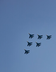 Naklejka na ściany i meble A group of MIG-29 fighters at the celebration of the day of the city of Novorossiysk in 2021 in summer
