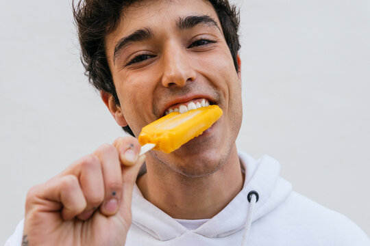 Man eating sweet ice lolly