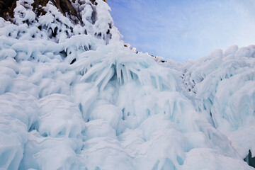 Fototapeta na wymiar Icicles on the rocks. Frozen Lake Baikal. Winter landscape.