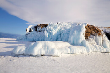 Winter landscape. Ice cliffs of Olkhon Island. Frozen Lake Baikal. 