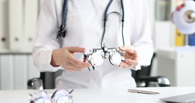 The optometrist shows the equipment for the selection glasses
