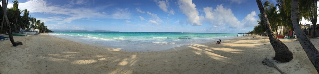 Panoramic view of a tropical white sand beach