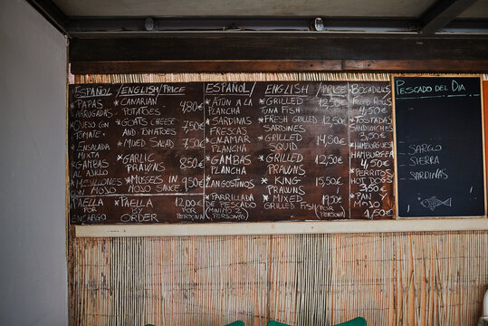 Blackboards with menu prices and inscriptions in restaurant