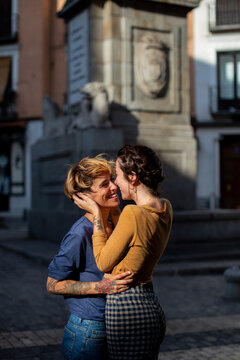 Lesbian couple having fun on street