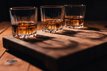 Wiskey on old wooden floors The background is a wooden wall.