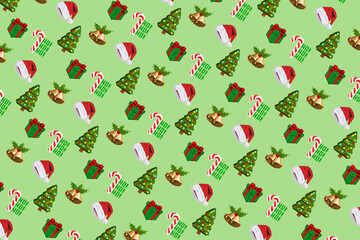 Colorful background of Christmas pattern made with Pixel Art. Funny Christmas wallpaper of Santa Claus, candy, gift boxes, christmas tree and bells.