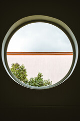 round window tree and house