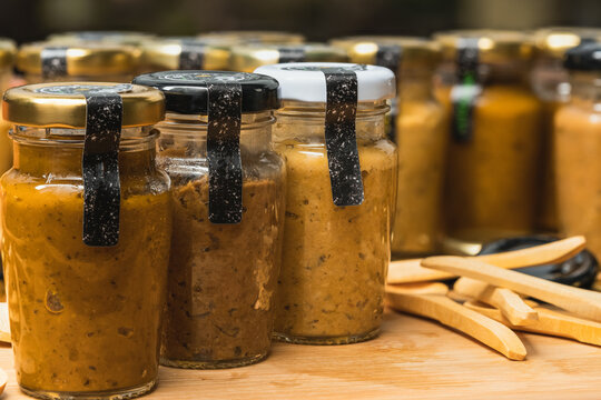 Many jars with vegetable sauce