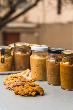 Many jars with vegetable sauce