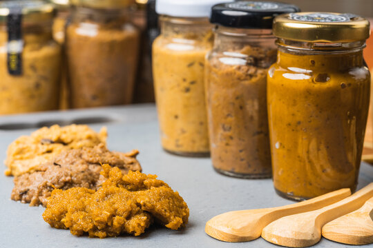 Many jars with vegetable sauce