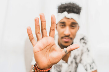 Man showing stop gesture at camera