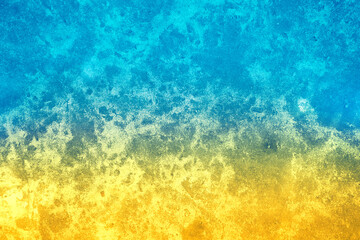 Fototapeta na wymiar Grunge concrete wall with blue yellow gradient color