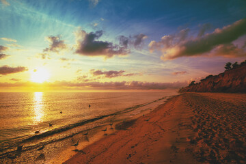 Fototapeta na wymiar Seascape with beautiful morning sky. Clay steep coast. Seashore during sunrise