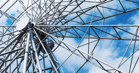 Obraz premium Fragment of a Ferris wheel in the park