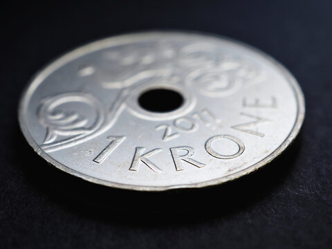 1 Norwegian krone coin close up. National currency of Norway. Money illustration for news about economy or finance. Banking and credit. Wages and taxes. Crown and Norges Bank. Macro