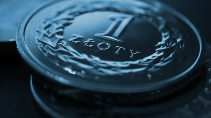 Translation: 1 zloty. Polish one zloty coin close-up. National currency and money of Poland. Dark blue tinted wallpaper or background for news about economy or finance. Macro