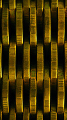 Stack of coins close up. Coin texture. Business vertical background made of many coin edges. Economy or bank phone wallpaper. Abstract money wall. Taxes, credit and currency exchange. Macro