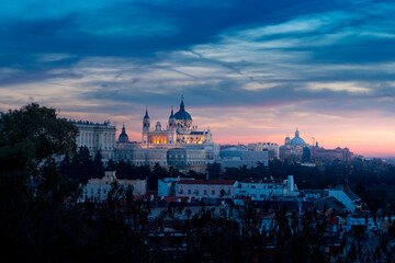 Old stone building in city with sunset sky