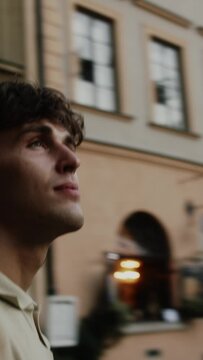 360 spin around a white man admiring an old European town