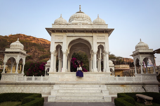 Glad Asian traveler in old ornamental building