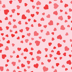 Seamless pattern with flat red hearts on the rose background