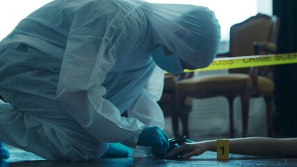 Detective Collecting Evidence in a Crime Scene. Forensic Specialists Making Expertise at Home of a Dead Person. Homicide Investigation by Professional Police Officer.