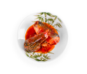 Mackerel fish in tomato sauce on plate isolated on white background