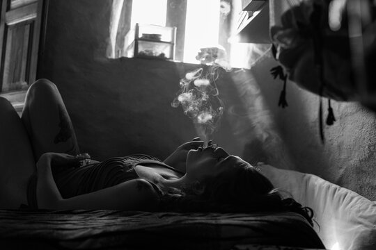 Female having relaxation while smoking weed