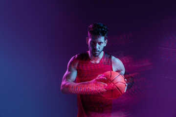 Studio Shot Of Basketball Player In The Studio with purple background