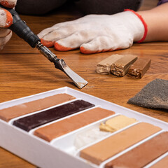 process restoration of laminate with wax pencils and a soldering iron.