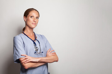 Happy confident doctor woman looking at on white background