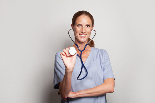 Medical Concept Of Beautiful Female Doctor In Blue Coat With Stethoscope