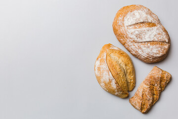 Homemade natural breads. Different kinds of fresh bread as background, top view with copy space