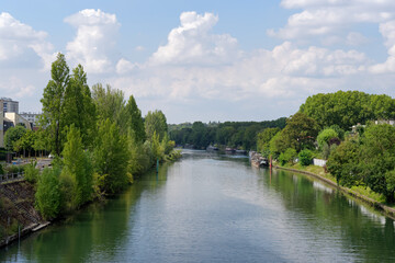 Fototapeta na wymiar Marne river between Maison-Alfort city and Saint-Maurice city in the Grand Paris area