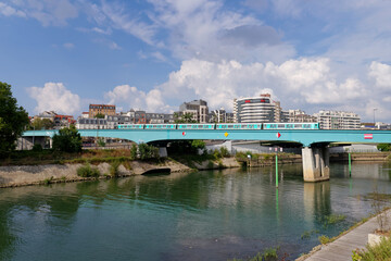 Fototapeta premium Aerial subway over the Marne river in Charenton-Le-pont city. Grand Paris area