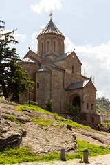 Fototapeta na wymiar A view of the ancient Metehi Church, built on the banks of the Mtkvari River in Tbilisi. Georgia is a country