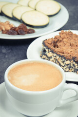 Fresh baked pastry made of zucchini and cup of white coffee. Delicious dessert