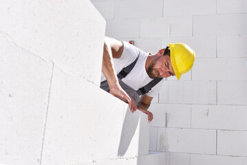 profession construction worker - work on a building site construction of a residential house