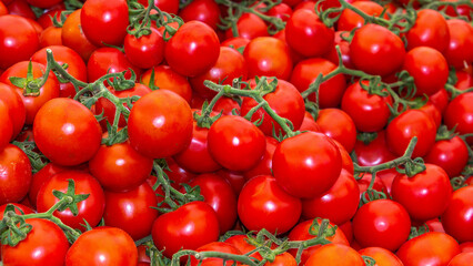 Fresh tomatoes on the street market. Background. Texture of natural tomato. Close-up