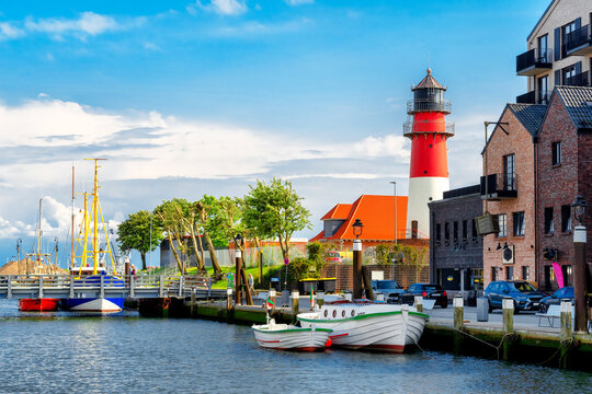Small fisher boats are moored in the harbor of B&uuml;sum in North Frisia, Germany