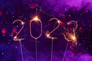 2023 Happy new year Silvester greeting card banner with burning golden sparklers shiny glitter...