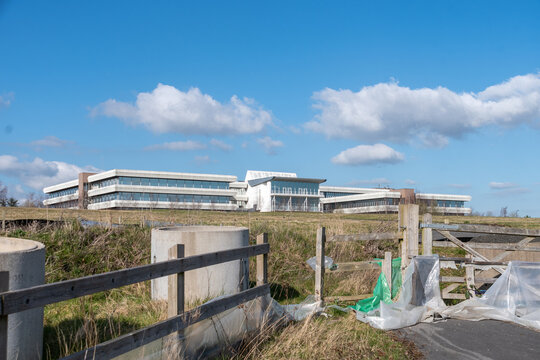 A view of Wakefield House, in Swindon taken from the south. The building is disused office space at the time the photo was taken with plastic covered fencing and building detritus in the foreground