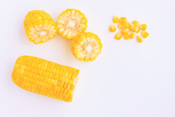 Yellow corn cobs slice with seeds on pink background