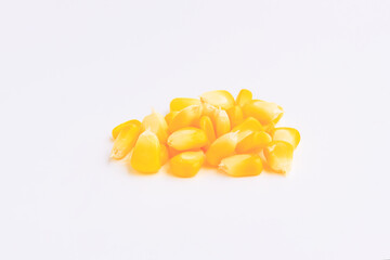 Yellow corn seeds on pink background, Close up